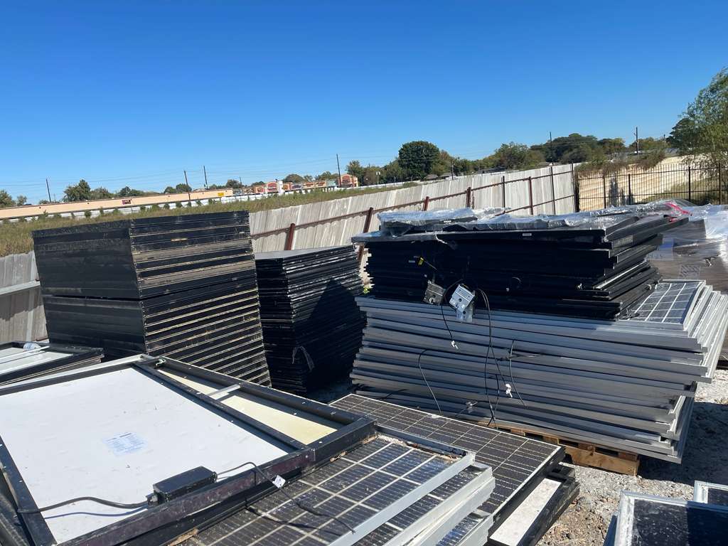 Solar panels on pallet with wind turbines